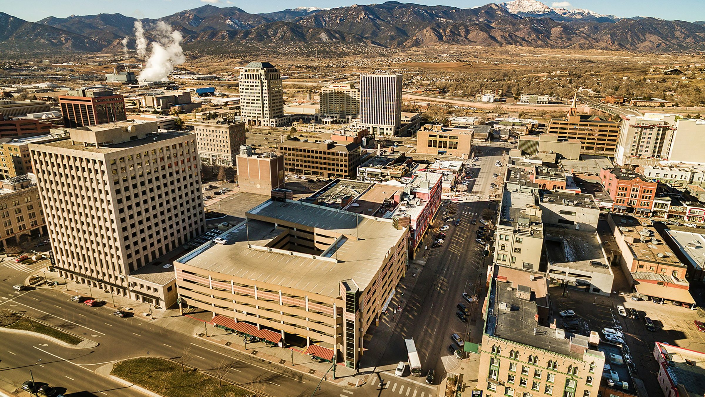 Aerial skyline of Colorado Springs rental property with Pikes Peak in the distance